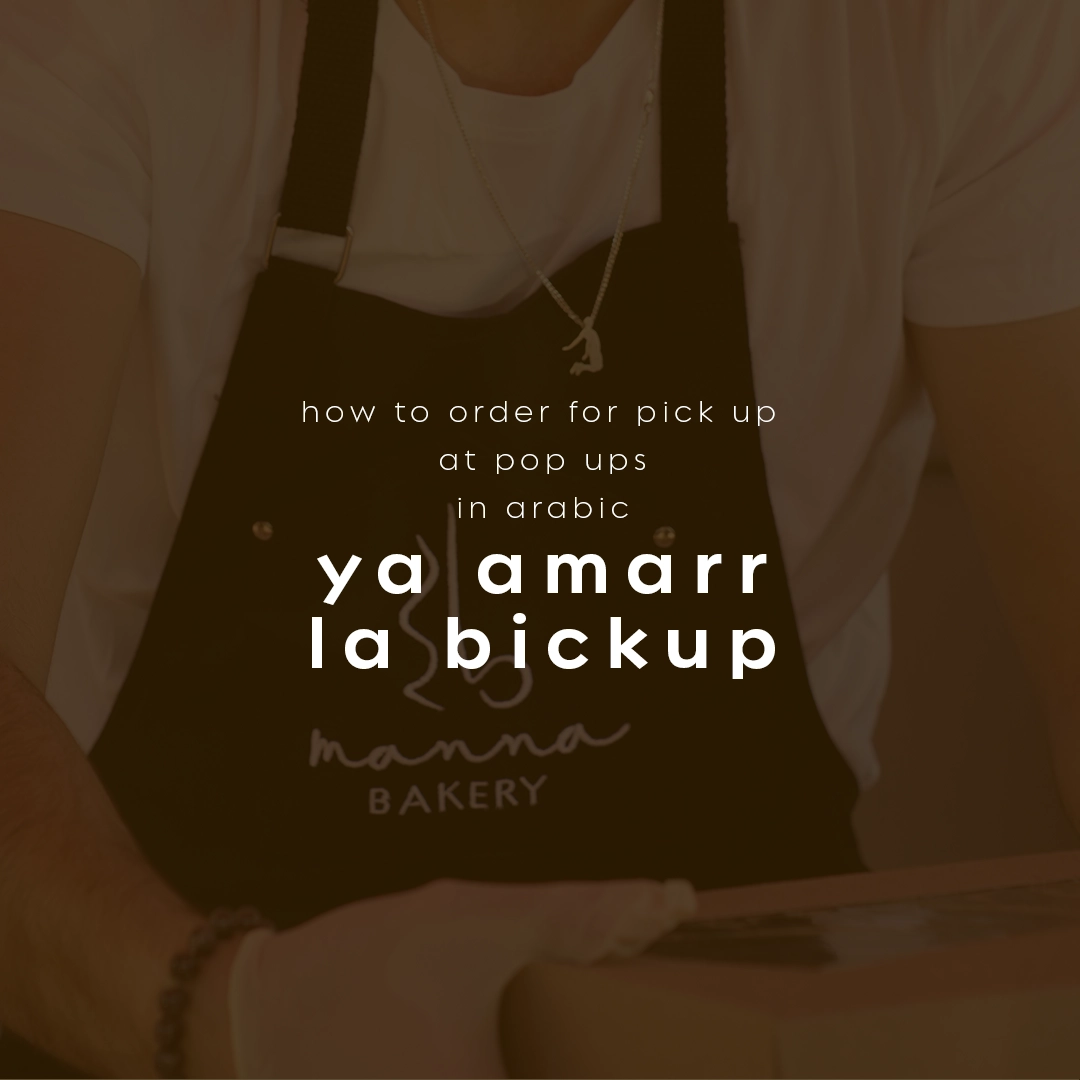Text explaining how to say 'how to order for pick up at pop ups' in Arabic as 'ya amarr la bickup,' over a person wearing a Manna Bakery apron.